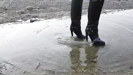 High heeled leather boots in river