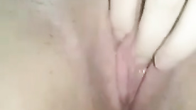 Nymphet masturbating her pussy with her fingers