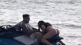 Amateur couple having sex on a jetski while he's in the water The wanker on the boat filmed it all