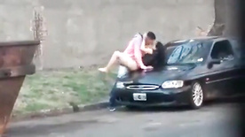 Amateur couple fucking on top of the car in the street