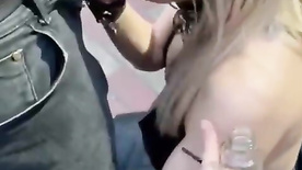 Drunk blonde giving a blowjob in front of the club
