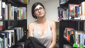 Big-breasted woman showing off in the library