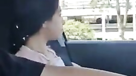 Horny little slut showing off in the moving car