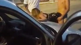 Friends fucking a slut in the middle of the street in public threesome