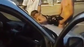 Friends fucking a slut in the middle of the street in public threesome