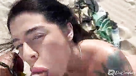 Big ass whore paying blowjob on the beach