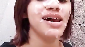 Slum girl smoking a cigarette with her face full of cum