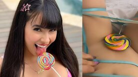 Juliana Bonde hiding her pussy with a lollipop
