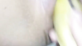 Naked slut cumming with a banana inside her pussy
