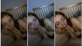 Green-eyed redhead giving blowjobs and watching TV