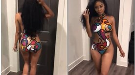 Naked black woman showing off with body paint