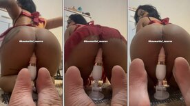 Kau Martini on all fours with a vibrator in her pussy
