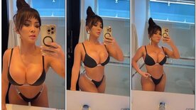 Sheyla Mell showing off in front of the mirror with a naughty face