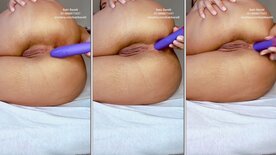 Babi Barelli on her knees cumming, rubbing her pussy with a dildo in her ass