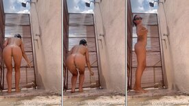 Daniela Antury bathing naked in the backyard