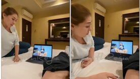 Man masturbates watching porn while his wife looks on