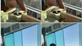 Couple fuck on the window overlooking the beach