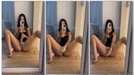 JapinhaDaMansão filming herself in front of the mirror playing with her pussy