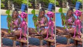 Tuani Basotti showing off in the pool with an ET doll