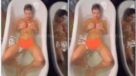 Naked Aline Limas in the bathtub with her tits showing