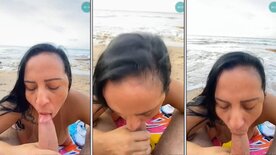 Josyvania giving a blowjob to a well-endowed man by the beach