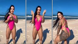 Brunette Brena Barbosa rolling on the beach with a swimsuit over her ass