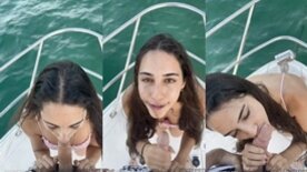 Aproveitando o passeio de barco a cadela Izzy Green fica de joelhos e mamando o dono da lancha