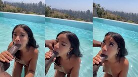 Skinny mulatto sucking giant black cock in the pool