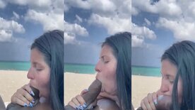 Amateur shot of brunette sucking huge black cock by the beach